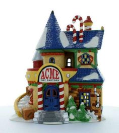 a toy house with candy canes on the roof