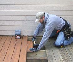 a man working on some wooden steps