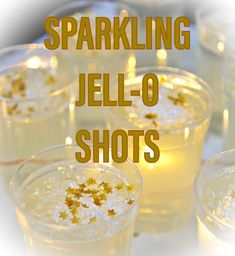 sparkling jello - o shots in glasses with gold sprinkles on them