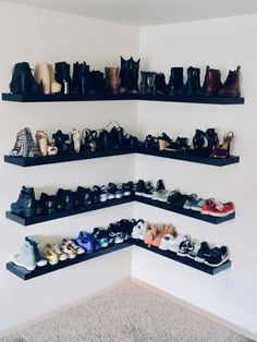 there are several shelves that have shoes on them