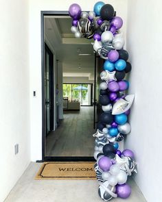 an entrance decorated with balloons and streamers