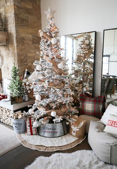 a white christmas tree in a living room