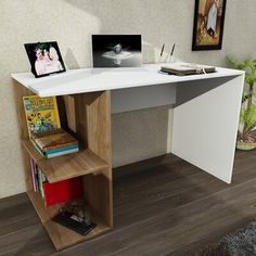 a white desk with books and pictures on it