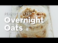 a jar filled with overnight oats sitting on top of a table