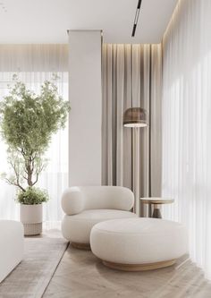 a living room with white furniture and a potted tree in the corner by the window