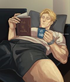 a man laying in bed while holding a book and reading the same book as he lays down