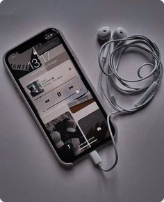 an iphone with ear buds connected to it