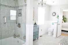 a bathroom with a tub, toilet and sink