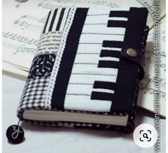 a black and white book with musical notes on it