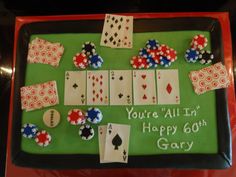 a birthday cake with playing cards and dices on the top, which reads you're all in happy 60th gay