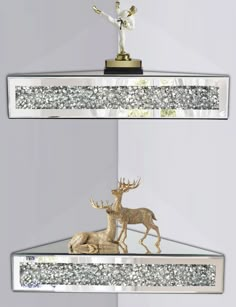 two glass shelves with gold and silver decorations on top of each shelf, one is holding a deer figurine