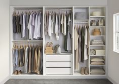 a white closet filled with lots of clothes