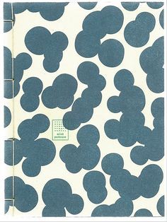 a notebook with blue and white designs on it