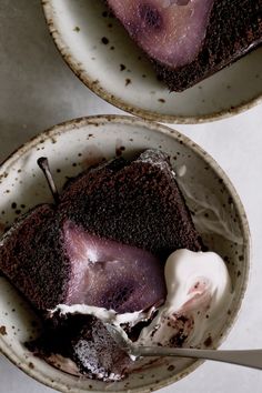 two bowls filled with chocolate cake and ice cream