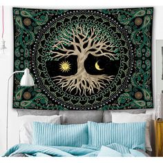 a tapestry hanging on the wall above a bed