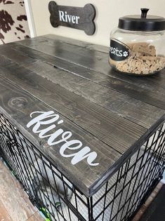 a dog crate sitting on top of a wooden table