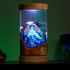 a glass jar with an underwater scene inside