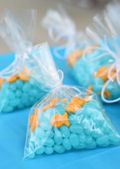 small bags filled with blue and orange candies