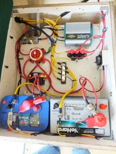 the inside of a box filled with assorted electrical equipment