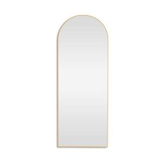 a white and gold arch mirror on a white wall with an empty space in the middle