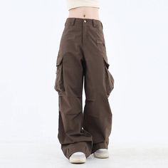 These classic-style brown pants feature a wide fit with cargo pockets Size: • S: Waist: 62cm/ 24.4 in, Length: 100cm/ 39.4 in• M: Waist: 66cm/ 26.0 in, Length: 101cm/ 39.8 in• L: Waist: 70cm/ 27.6 in, Length: 102cm/ 40.2 in• XL: Waist: 74cm/ 29.1 in, Length: 103cm/ 40.6 in• XXL: Waist: 80cm/ 31.5 in, Length: 104cm/ 40.9 inMaterial: Cotton, Polyester Baggy Brown Bottoms With Side Pockets, Brown Baggy Bottoms With Side Pockets, Brown Fall Bottoms For Streetwear, Baggy Brown Cargo Style Bottoms, Baggy High Waist Brown Parachute Pants, Casual Baggy Brown Cargo Pants, Brown Baggy Cargo Style Bottoms, Brown Baggy Full-length Cargo Pants, Baggy Brown Long Pants