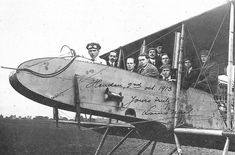 an old airplane with many people in it