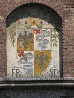 a coat of arms on the side of a building