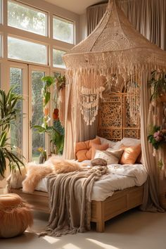 a bedroom with a canopy bed and lots of plants in the window sill area