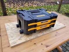 a tool box sitting on top of a wooden table