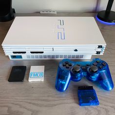 a video game console sitting on top of a wooden table