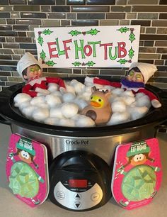 an elf hot tub filled with marshmallows and snowballs for the holidays