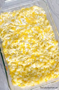 a casserole dish filled with macaroni and cheese in a glass baking dish