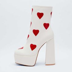 Elevate your style with these white square toe block heel platform ankle boots featuring a charming heart detail. Strut in comfort and chic fashion with this unique and trendy footwear choice. Color: White Material: Faux leather Heel Type: Block heel Heel Height: 4.72" / 120 mm approx Platform Height: 2'' / 50 mm approx Product measurements were taken using size 8. Please note that measurements may vary by size. Toe: Square toe Heart detail design Side-zip design Handcrafted US sizing. Fits true to size. White High Ankle Platform Boots, White High Heel Platform Boots With Chunky Platform, Trendy White High Heel Platform Boots, Trendy White High Heeled Platform Boots, White Square Toe Platform Boots, White Chunky Platform High Heel Boots, White Platform Boots With Chunky Block Heel, Trendy White High Heel Boots, White Chunky Platform Heeled Boots With Round Toe