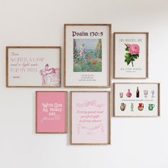 there are many framed pictures on the wall with pink and white designs in them,