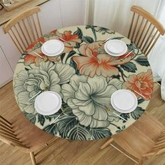 the table is set with two plates and four chairs, which are decorated with flowers