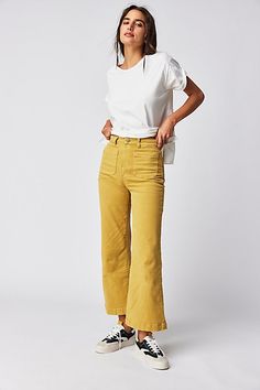 High-waisted jeans featured in a wide-leg silhouette. * Authentic denim* Front and back patch pockets * Button closure and zip fly Colored Jeans Outfits, Mustard Yellow Pants, Sailor Jeans, Sailor Jean, Jeans Free People, Yellow Pants, All Jeans, Free People Store, Wide Jeans