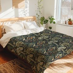 a bed in a room with a large blanket on top of it