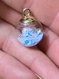 Cute clear glass globes with opal triangle confetti inside! Top is gold plate with loop. These would be cute as little girl jewelry! Loop is large enough to use a ribbon or cord! More colors of glass ball charms in shop! ball measures 16mm, loop ID 2mm spiritualnaturegifts.etsy.com New listings added daily! Be sure to favorite my shop! Thanks for looking! Glass Globes, Keychain Charm, Magical Jewelry, Posing Guide, Girl Jewelry, Fantasy Jewelry, Snow Globe, Des Moines, Glass Ball