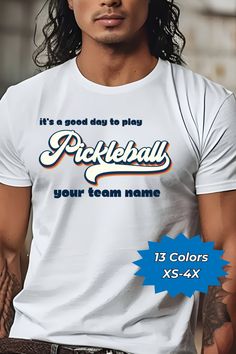 a man with long hair wearing a t - shirt that says pickleball your team name