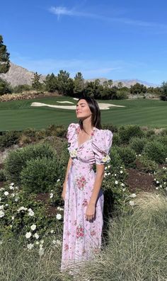 a woman standing in the grass with her eyes closed and text reading kendall jenny easter look