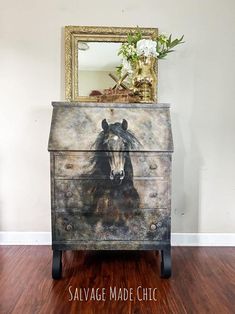 a dresser with a horse painted on it