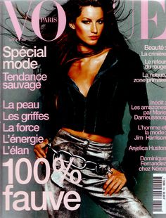 a magazine cover with a beautiful woman in black top and silver pants on the cover