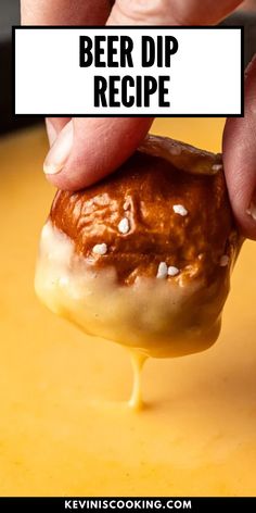 a person dipping some kind of food into a bowl with the words beer dip recipe on it