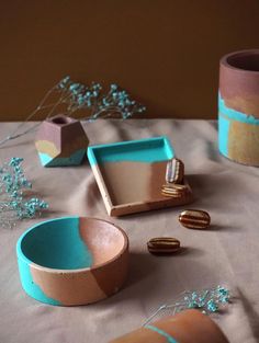 the table is covered with blue and pink dishes, including one for desserts or cookies