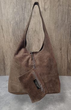 Real Suede Leather Tote bag Slouch Bag Hobo Handbag Suede Leather shoulder bag Open top with magdot closure  Additional zipped purse with chain  Silver tone metal hardware  Soft Real Suede  Handle drop: 38cm  Dimensions: H60cm x W37cm x D16c Slouch Bag, Slouch Bags, Hobo Handbag, Hobo Handbags, Leather Tote Bag, Leather Tote, Suede Leather, Leather Shoulder Bag, Silver Chain