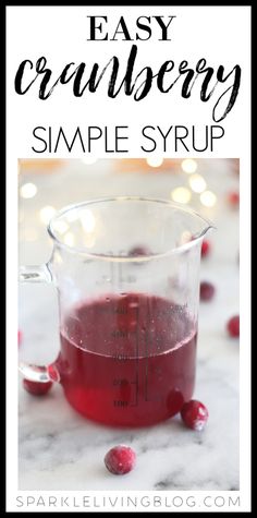 cranberry sauce in a measuring cup with the words easy cranberry simple syrup