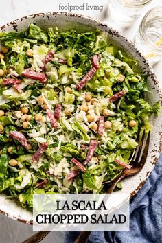 a salad with lettuce, beans and ham in a bowl