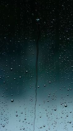 water drops on the window glass as it is raining