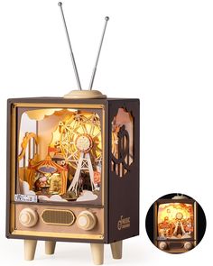 an old fashioned television with some decorations on it