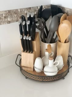 there are many kitchen utensils in the holder